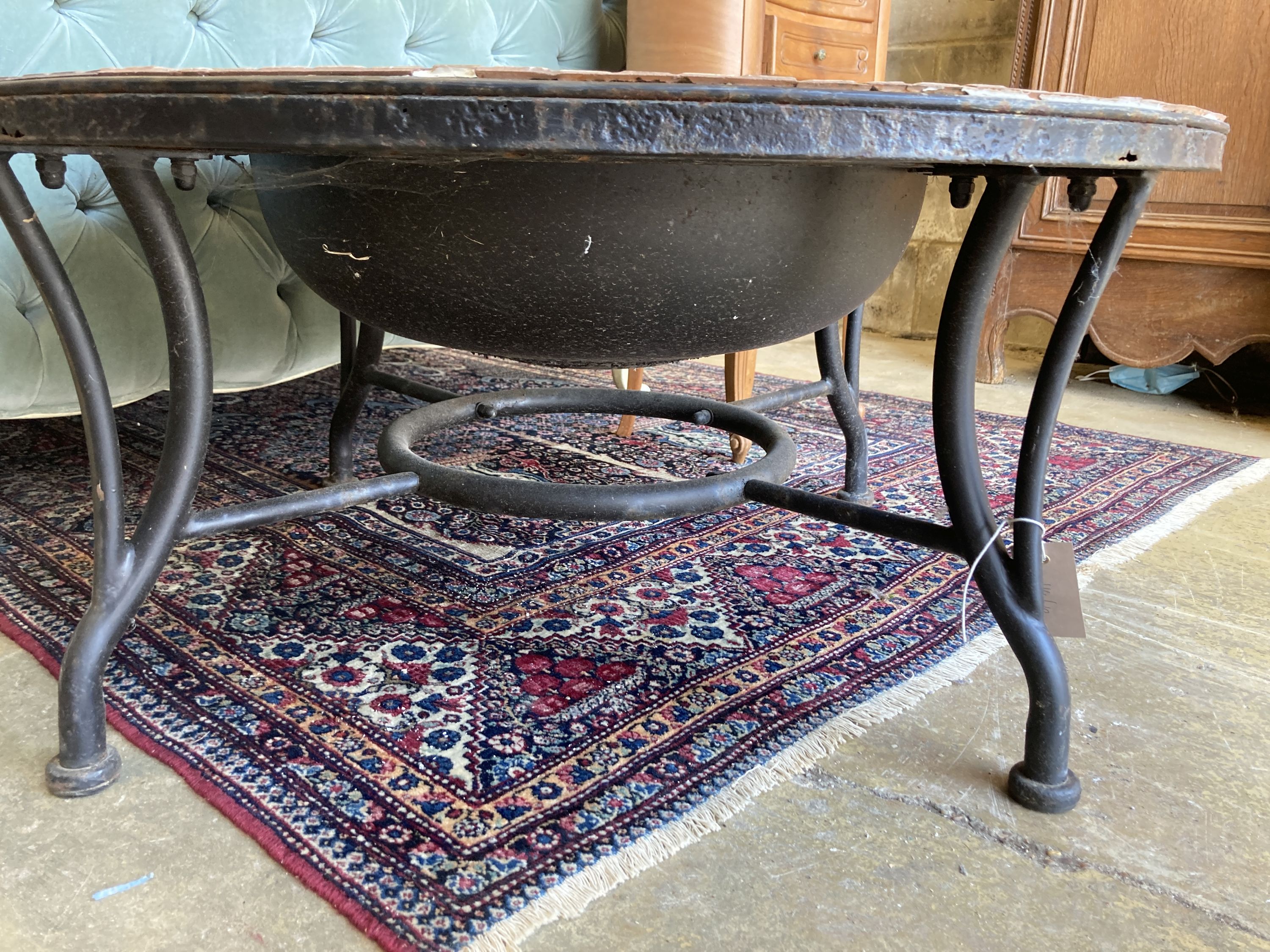 A mosaic top firepit